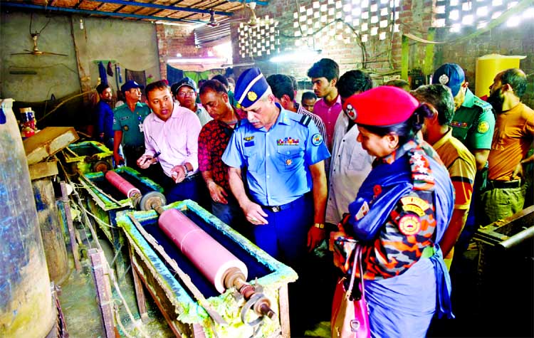 Task force of DSCC inspecting the burnt chemical warehouses during the ongoing eviction drive in Old Dhaka. This photo was taken from Islambagh area in Lalbagh on Wednesday.