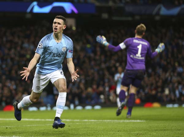 Manchester City's Phil Foden celebrates after scoring his side's sixth goal during the Champions League round of 16 second leg, soccer match between Manchester City and Schalke 04 at Etihad stadium in Manchester, England on Tuesday.