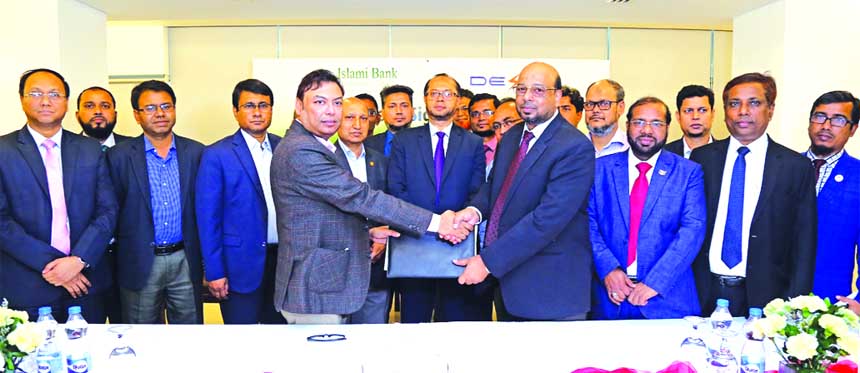 Abu Reza Md. Yeahia, DMD of Islami Bank Bangladesh Limited (IBBL) and SM Zamil Hussain, Company Secretary of Dhaka Electric Supply Company Limited (DESCO), exchanging an agreement signing document at a hotel in the city recently. Under the deal, IBBL will