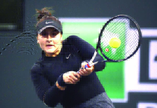 Bianca Andreescu of Canada, returns a shot to Elina Svitolina of Ukraine at the BNP Paribas Open tennis tournament in Indian Wells, Calif on Friday.