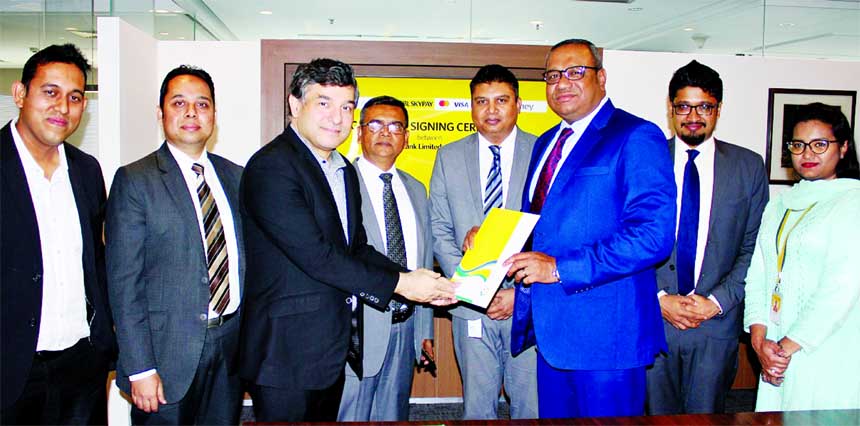 M. Khorshed Anowar, Head of Retail and SME Banking, Eastern Bank Ltd (EBL) and Aref R. Bashir, Co-founder and Managing Director of Dmoney exchanging documents after signing an agreement at EBL Head Office at Gulshan in the city.