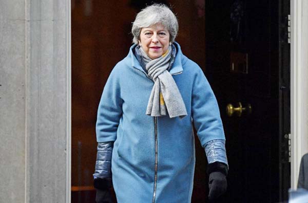 Britain's Prime Minister Theresa May leaves 10 Downing Street in London on March 14, 2019, ahead of a further Brexit vote on extending Article 50.
