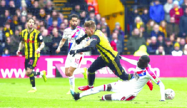 Crystal Palace's Cheikhou Kouyate (right) and Watford's Gerard Deulofeu battle for the ball during the FA Cup quarter final soccer match between Watford and Crystal Palace, at Vicarage Road in Watford, England on Saturday.