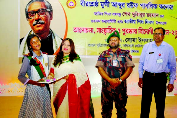 Chief patron of BGB Children Club and Ladies Club Mrs. Soma Islam distributing prizes among the winners of a cultural function organised on the occasion of the 99th birth anniversary of Bangabandhu Sheikh Mujibur Rahman and National Children's Day in the