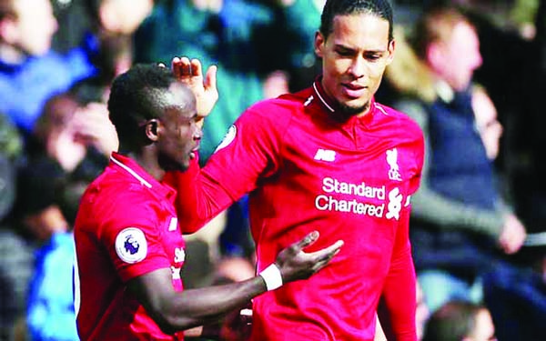 Liverpool's livewire Sadio Mane (left) scored one goal and played a crucial part in the other as they reclaimed the Premier League's top spot with a scrappy 2-1 win against Fulham at Craven Cottage on Sunday.