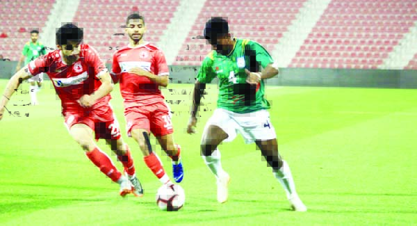 An action from the practice football match between Bangladesh Under-23 National Football team and Al Arabi Club at Doha in Qatar on Tuesday.
