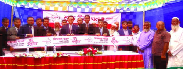 Md. Ahsan-uz Zaman, Managing Director of Midland Bank Limited, inaugurating its Agent Banking Centre at Chandahar in Shingair in Manikgonj on Monday. Md. Ridwanul Haque, Head of Retail Distribution, Md. Mahbubur Rahman, Head of Operation Division, Md. Toh