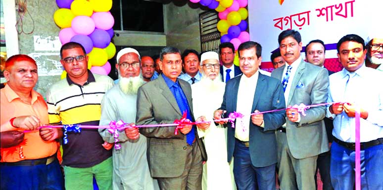 Md. Bayazid Sk, Head of Banking Operations Division of South Bangla Agriculture & Commerce (SBAC) Bank Limited, inaugurating its shifted Bogura Branch to new location at Talukdar Plaza of Barogola in Rangpur Road in Jhautala in Razabazar on Tuesday. Md. D