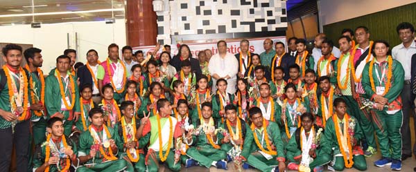 Members of Bangladesh Special Olympic team with State Minister for Youth and Sports Zahid Ahsan Russell pose for a photo session at the Hazrat Shahjalal International Airport on Friday night. Bangladesh Special Olympic team clinched 22 gold medals, 10 sil