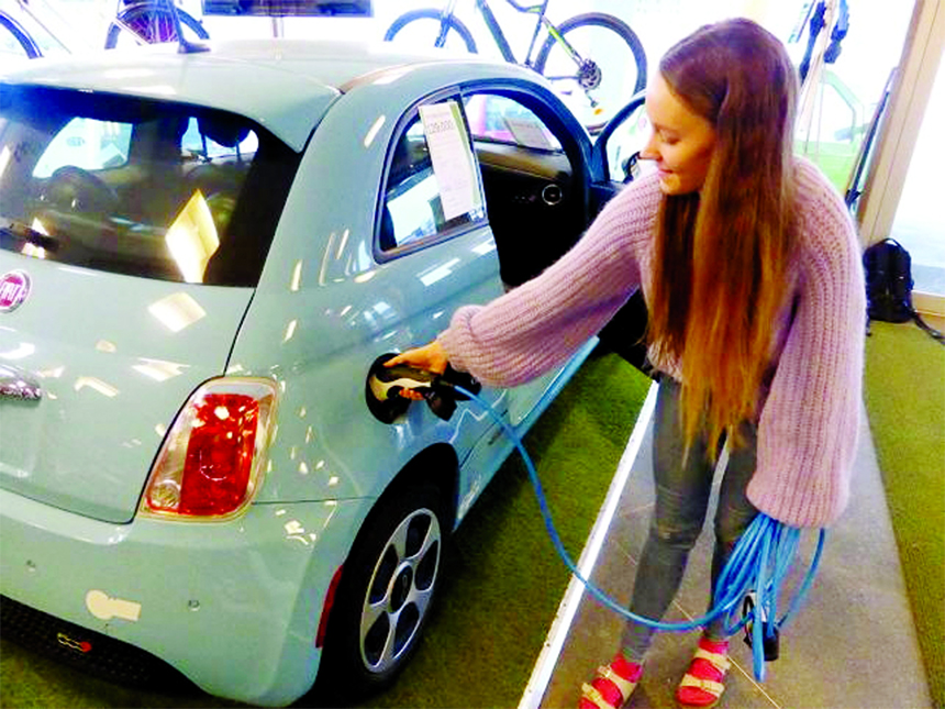 Skram of Buddy Electric car dealer company shows the charging of a second-hand Fiat 500e in Oslo.