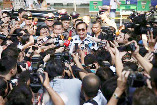 Thailand's Prime Minister Prayuth Chan-ocha speaks to media after voting in the general election at a polling station in Bangkok on Sunday.