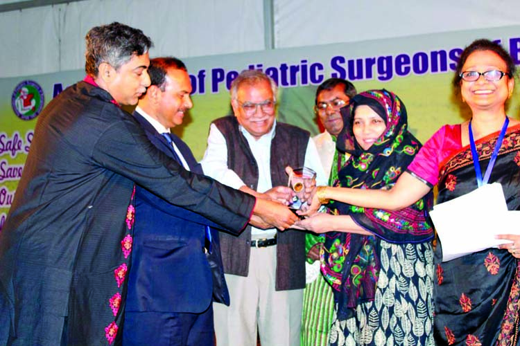 Prof Dr. Tahmina Banu, Director, Chattogram Research Institute for Children Surgery and Former Head, Pediatric Surgery Department, Chattogram being awarded with Prof. Quazi Quamruzzaman Best Pediatric Surgeon Gold Medal-2019 at a ceremony organised