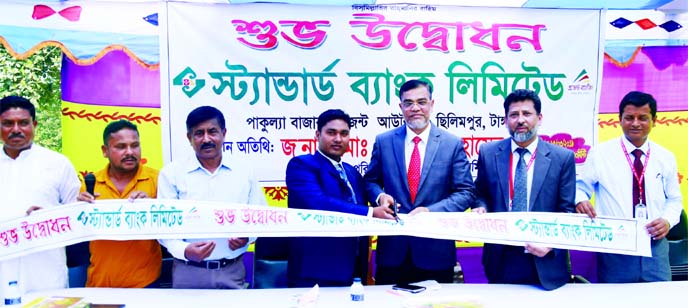 Md. Motaleb Hossain, Deputy Managing Director of Standard Bank Ltd, inaugurating its 24th Agent Outlet at Pakulla Bazar, Chilimpur in Tangail on Monday. Md. Badar Uddin, Manager of Tangail Branch and Banking Agent Shazal Hossain were also present.