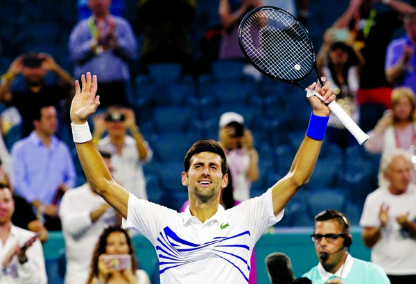 Novak Djokovic of Serbia, celebrates after his match against Federico Delbonis of Argentina, during the Miami Open tennis tournament in Miami Gardens, Fla on Sunday. Djokovic won 7-5, 4-6, 6-1.