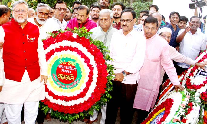 CCC Mayor A J M Nasir Uddin with other leaders placing wreaths at the Chattogram Central Shaheed Minar in observance of the Independence and National Day organised by Chattogram City Awami League on Tuesday.