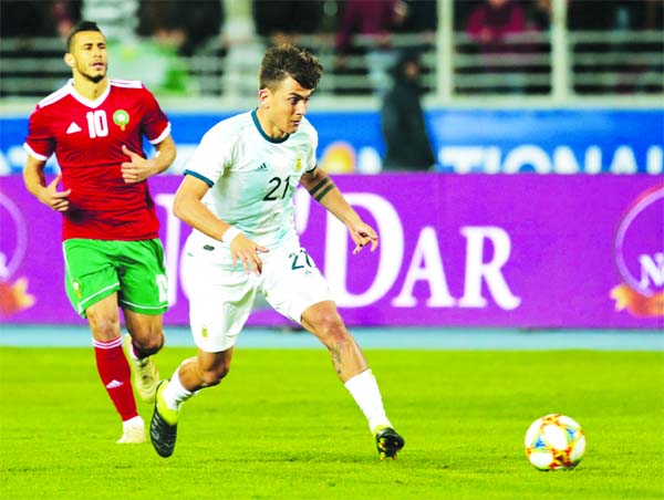 Argentina's Paulo Dybala (right) eyes the ball as Morocco's Younes Belhanda looks on during an international friendly soccer match between Morocco and Argentina in Tangier, Morocco on Tuesday.