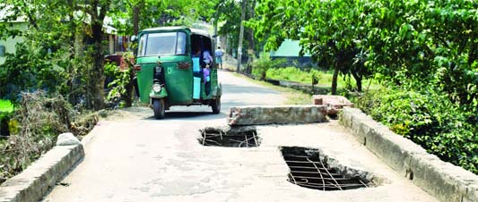 BOGURA: The bridge on Matidali -Dharampur Road in the Bogura poura area needs immediate repair . This snap was taken on Wednesday.