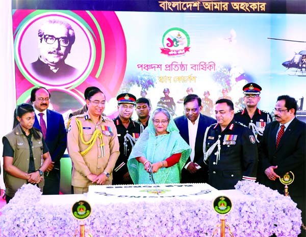 Prime Minister Sheikh Hasina cutting cake marking the 15th founding anniversary of Rapid Action Battalion (RAB) at its Headquarters in the city on Thursday.