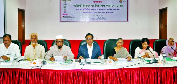 DSCC Mayor Sayeed Khokon along with other distinguished persons at a mass hearing on 'Fire-risk Free and Safe Old Dhaka'organised by different organisations in CIRDAP Auditorium in the city on Thursday.