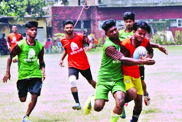 A scene from the First Security Islami Bank Limited National Rugby Competition between Habiganj District team and Chandpur District team at Physical Education College Ground in the city's Mohammadpur on Thursday.