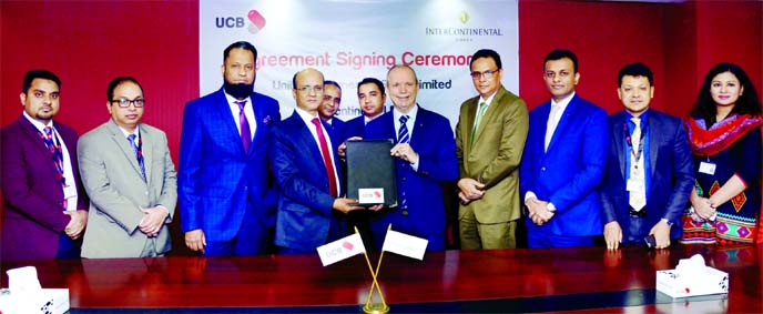 Md. Abdullah Al Mamoon, DMD of United Commercial Bank (UCB) Limited and James P. McDonald, General Manager of InterContinental Dhaka, exchanging an agreement signing document at the Bank's head office in the city recently. Under the deal, UCB Platinum Cr
