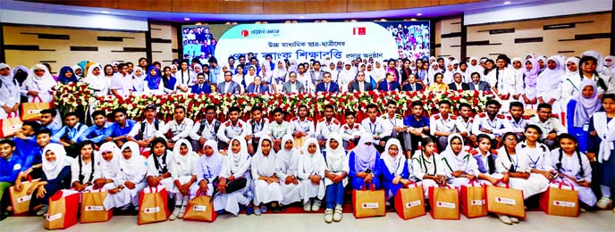 Sayeed H. Chowdhury, Chairman, Board of Directors of ONE Bank Limited, poses for a photo session with the scholarship winners from various educational institutions of Dhaka and sub-urbs of Dhaka arranged by the Bank at Officers' Club in the city Thursday