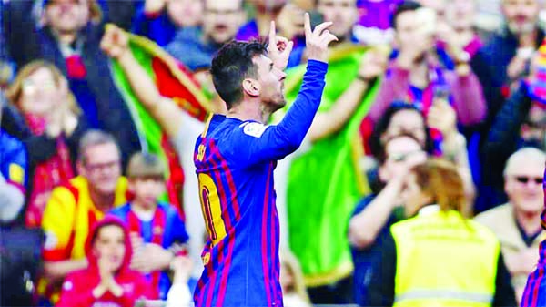 Barcelona's Lionel Messi celebrates after scoring the opening goal during a Spanish La Liga soccer match between FC Barcelona and Espanyol at the Camp Nou stadium in Barcelona, Spain on Saturday.