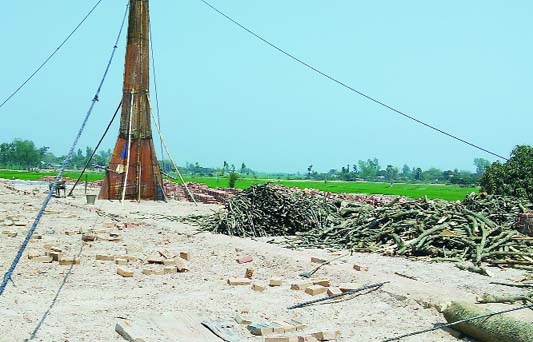 SAPAHAR (Naogaon): Brick field at Shimuldanga Ramasharm Village in Sapahar Upazila using wood defying government ban. This snap was taken yesterday.