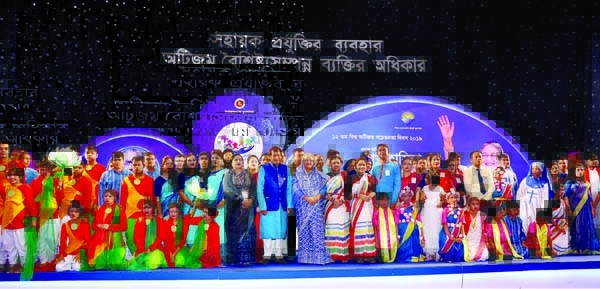 Prime Minister Sheikh Hasina poses for photograph with autism children at the inaugural function of the 12th World Autism Awareness Day-2019 at the Bangabandhu International Conference Center in the city on Tuesday.