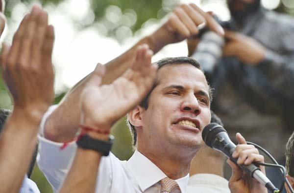 Venezuelan opposition leader and self-proclaimed interim president Juan Guaido speaks during a rally in San Bernardino neighbourhood in Caracas on Monday.