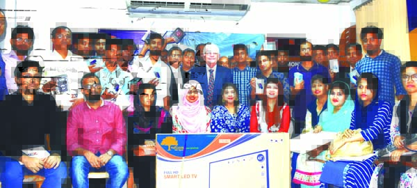 M M Monirul Alam, Managing Director of Guardian Life Insurance Limited, poses for a photo session with the Digital Media Competition Winners award giving ceremony at its head office in the city recently. David Griffiths, Director, Mohammad Shazzadul Karim