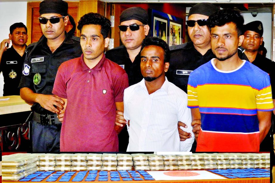 Three members of drug smuggling syndicate along with eight lakh Yaba pills were arrested from city's Sadarghat area early Tuesday. This photo was taken from RAB media centre.