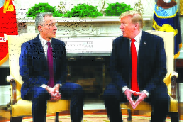 US President Donald Trump speaks during a meeting with NATO Secretary-General Jens Stoltenberg in the Oval Office of the White House on Tuesday.
