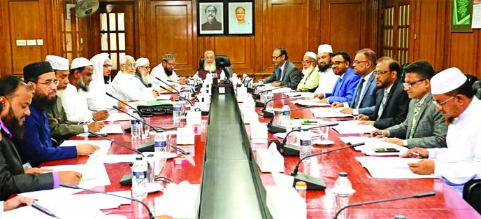 Sheikh Moulana Mohammad Qutubuddin, Chairman of Shari`ah Supervisory Committee of Islami Bank Bangladesh Limited, presiding over its meeting the Bank's head office in the city on Wednesday. Md. Mahbub ul Alam, Managing Director, Dr. Mohammad Abdus Samad,