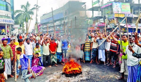 State-owned jute mill workers staged demonstration, blockading roads and set fire on tyre for the 3rd consecutive day as part of 72-hour strike to press home their 9- point demands. This photo was taken from Demra area on Thursday.