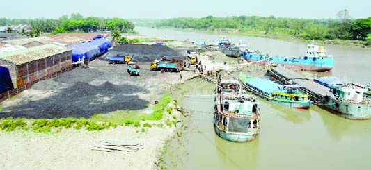 JASHORE: Influentials running coal business illegally occupying Bhairab River at Lohagara Upazila. This snap was taken on Wednesday.