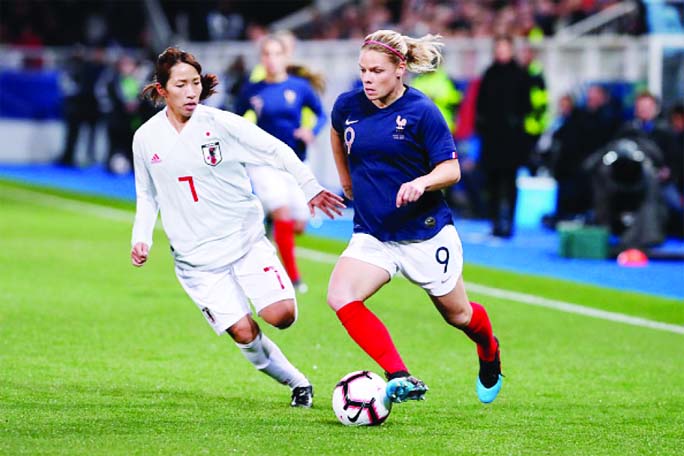 Eugenie Le Sommer (9) of France, controls the ball against Emi Nakajima (7) of Japan, during the International Friendly game between France and Japan at Stade de L'Abbe-Deschamps in Auxerre, France on Thursday.