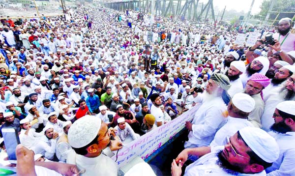Thousands of Musallies staged demonstration, blockading roads at Lohar Pool area of Kamrangir Char on Friday, demanding punishment to Maulana Saad supporters responsible for attacking Alem-Ulema and Tablig Jamaat participants and called for banning of th