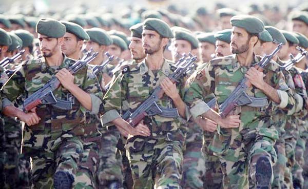 Members of the Iranian revolutionary guard march during a parade to commemorate the anniversary of the Iran-Iraq war (1980-88), in Tehran.