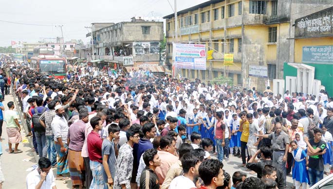 Students stage demonstration, blocking road on Dhaka-C'Bazar Highway protesting injuring of their female fellow of Patiya A.J Chowdhury High School by Tempo which hits her on Saturday.