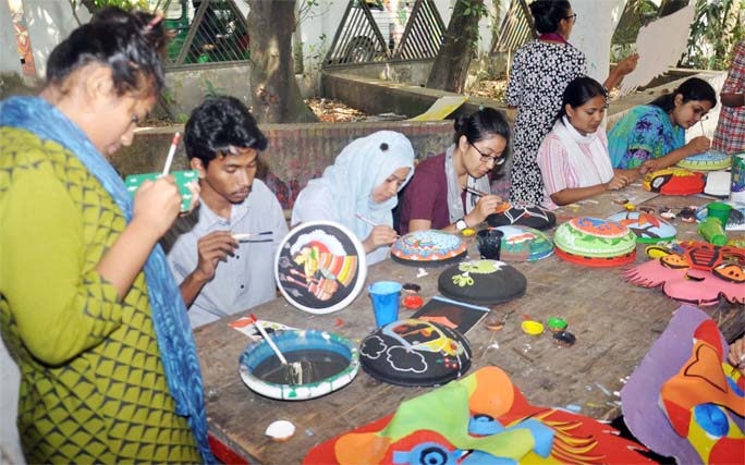 Students of Art Institute in Port City passing busy time in craft works marking the upcoming Pahela Baishakh. This picture was taken yesterday.