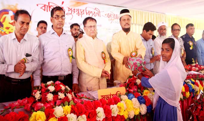 Prof Dr Abu Reza Mohammad Nizamuddin Nadvi distributing prizes among the winners of Annual Sports of Demsha High School in Satkania recently.