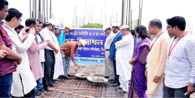 Prof Dr Nazmul Ahsan Kalimullah, Vice-Chancellor of Begum Rokeya University, Rangpur inaugurating the casting works of first floor's roof of Dr Wazed Research and Training Institute of the University on Friday.