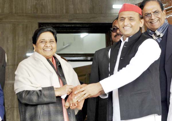 Samajwadi Party President Akhilesh Yadav (right) greets Bahujan Samaj Party Chief Mayawati on her birthday in Lucknow, India.