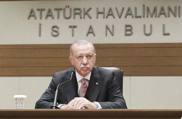 Turkey's President Recep Tayyip Erdogan talks to members of the media regarding the local elections, in Istanbul on Monday.