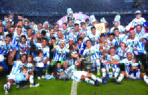 Racing Club players celebrate with their national league trophy after defeating Defensa y Justicia in Buenos Aires, Argentina on Sunday. Racing Club, one of the five giants of Argentinian soccer, won its ninth national league trophy last weeken