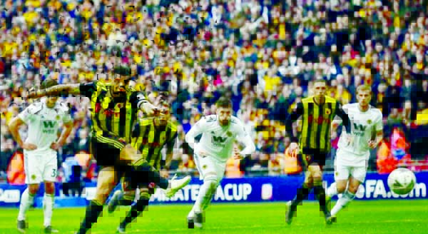 Watford's Troy Deeney scores his side's second goal from the penalty spot against Wolverhampton Wanderers during the English FA Cup semi-final football match at Wembley on Sunday.