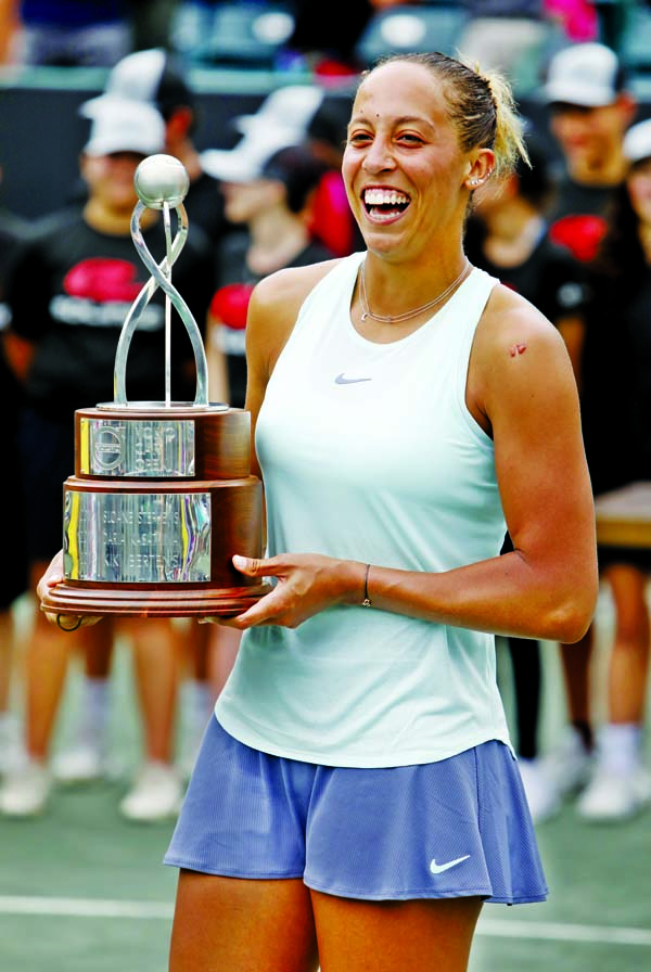 Madison Keys holds the championship trophy after defeating Caroline Wozniacki from Denmark to win their finals match at the Volvo Car Open Tennis tournament in Charleston, SC on Sunday.