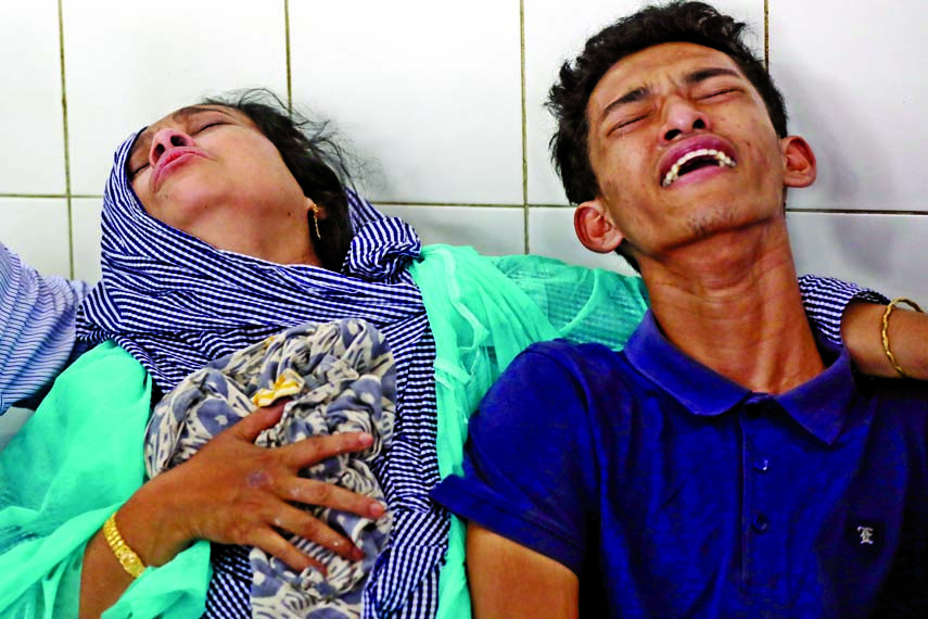 Relatives of Feni Madrasa girl fire victim wailing at Dhaka Medical College Hospital Burn Unit on Monday.