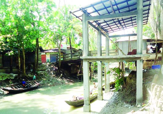 BANARIPARA (Barishal ) : A building is being constructed occupying a canal at Banaripara in Barishal . This picture was taken yesterday.